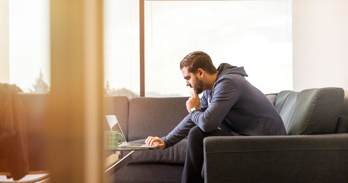 man at home on laptop