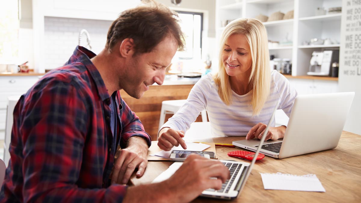 Leaptel - couple at table on computers